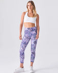 Feel confident and comfortable in our 7/8-length yoga leggings with a unique pink-purple print and a handy front pocket.
