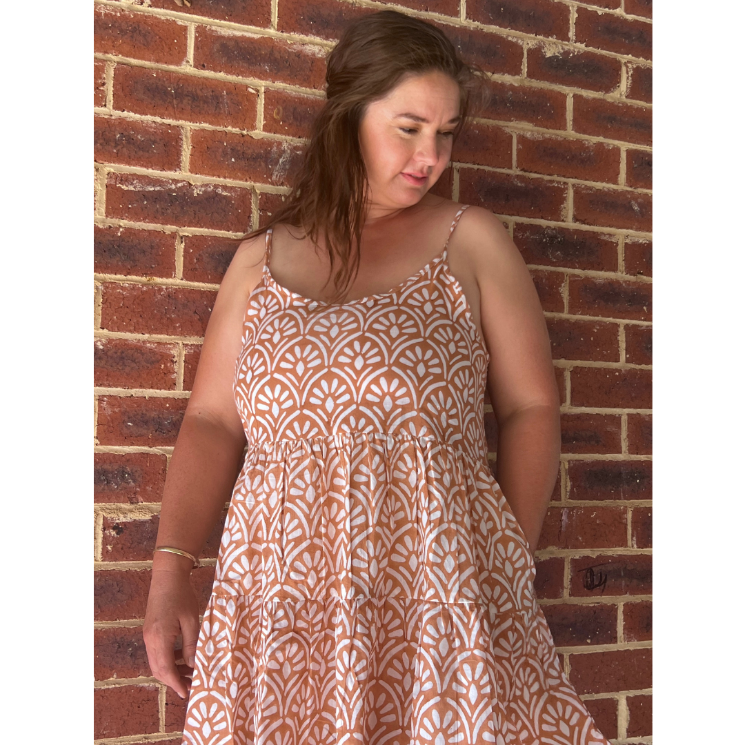 This 100% cotton summer dress with adjustable straps ensures the perfect fit & breezy comfort. Shop your new go-to dress!