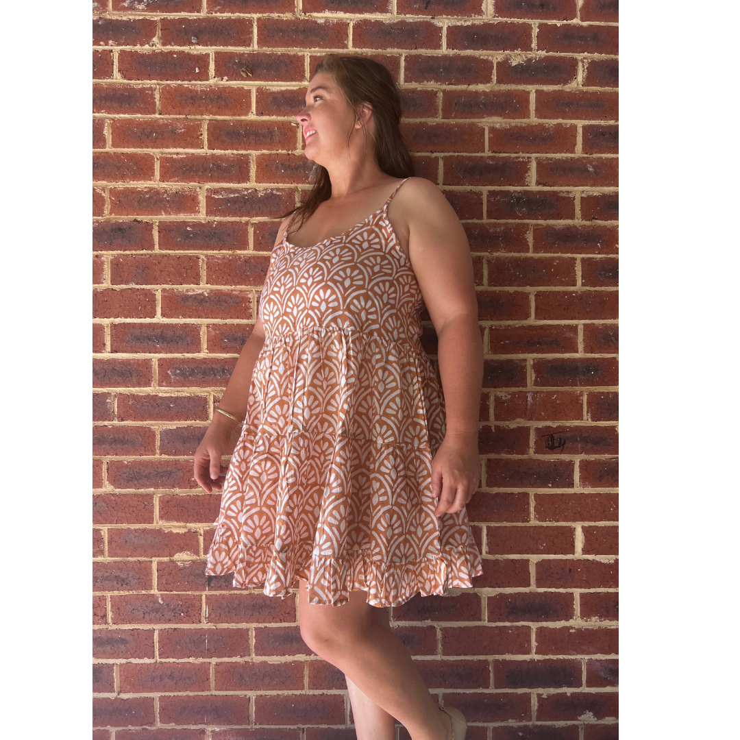 This adjustable-strap cotton dress is a must-have for effortless elegance. Handmade & eco-friendly. Shop now!