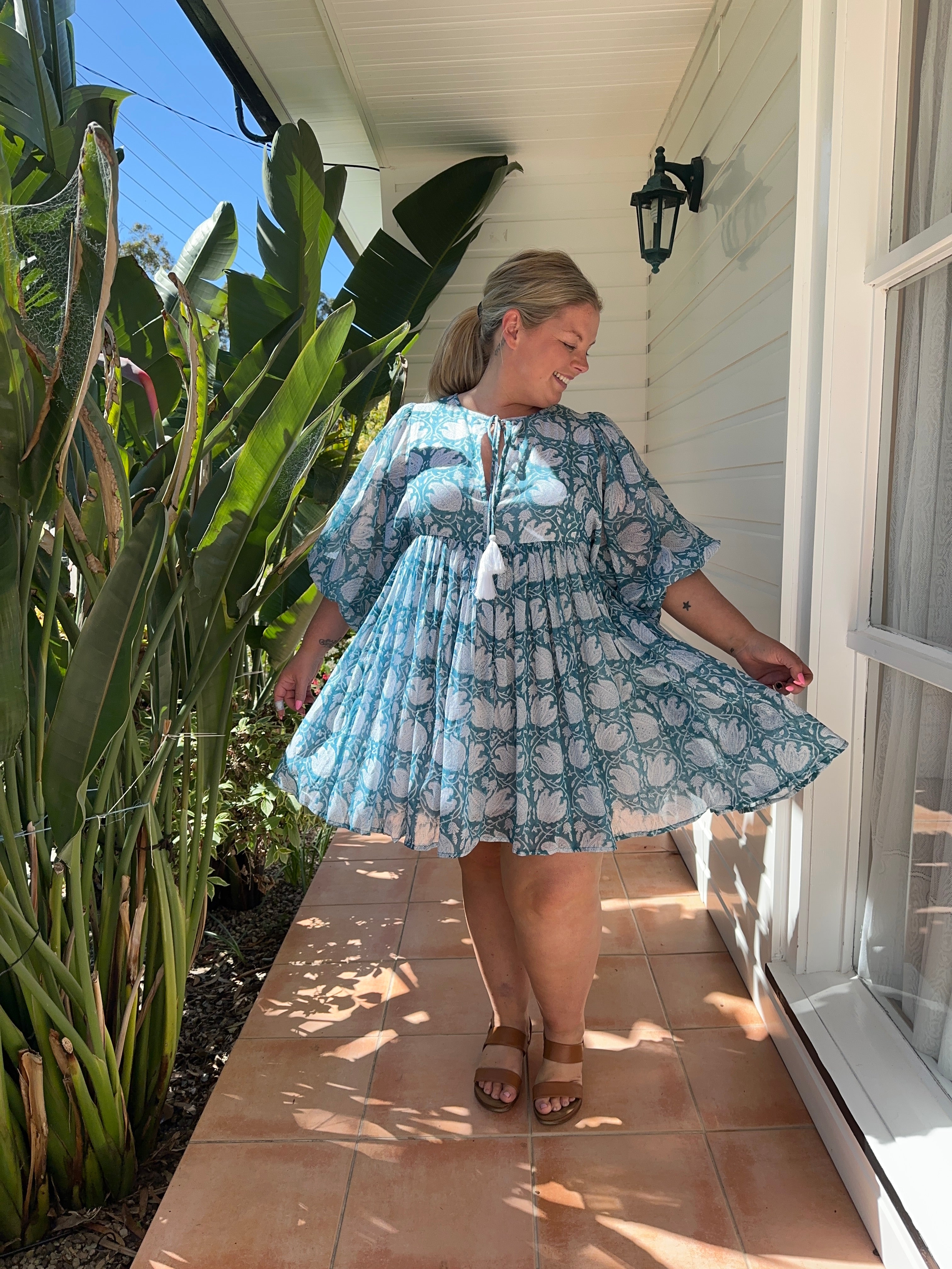 Stylish blue midi dress with a flowing skirt, ideal for both casual and semi-formal events.