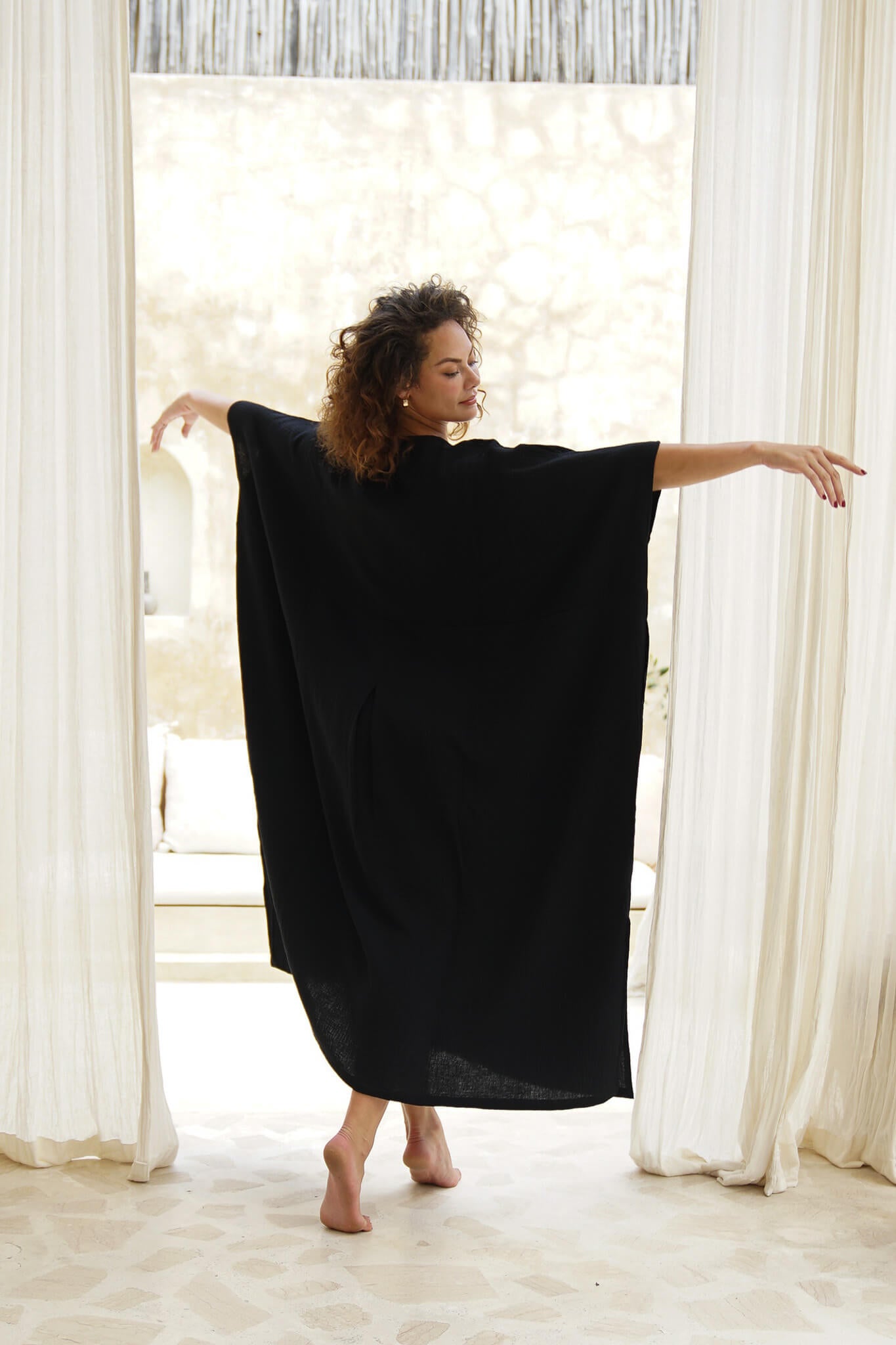 Indulge in comfort and style with our black cotton gauze kaftan. Perfect for any occasion.