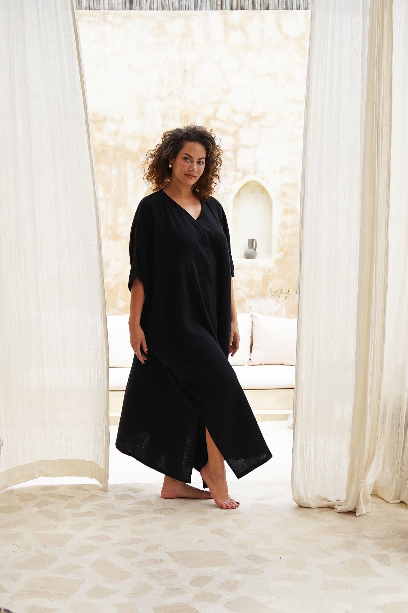 Elevate your wardrobe with our black cotton gauze sustainable kaftan dress. Effortless sophistication in every stitch.