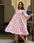 "Cotton midi dress: Handcrafted elegance with long sleeves, showcasing artisanal expertise."