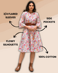 Paisley-print cotton midi dress with 3/4 sleeves, featuring a twirl-ready silhouette. The dress has a fitted bodice, flowing skirt, and lightweight fabric for a stylish yet comfortable look.