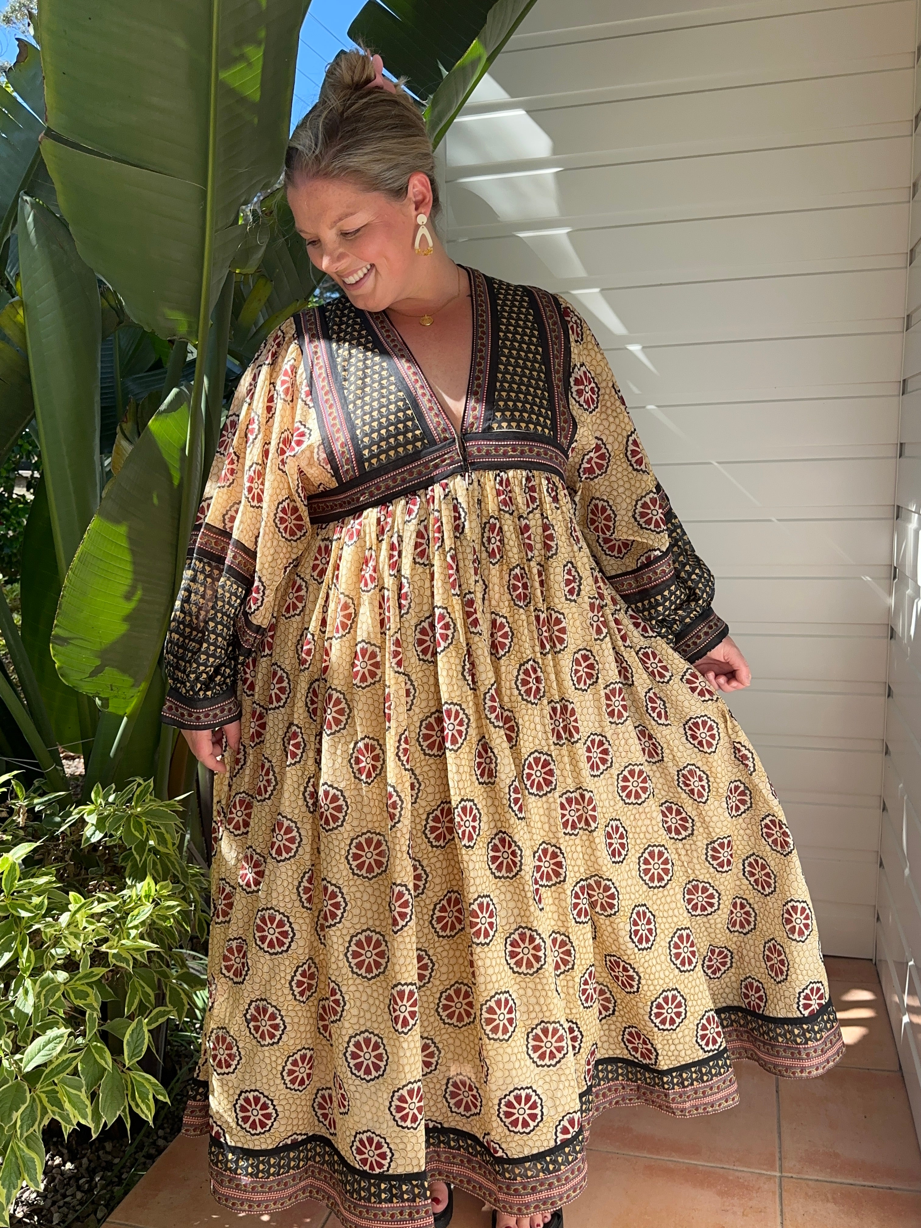 A cream cotton maxi dress with long sleeves—flattering, eco-friendly & effortlessly stylish. Don't miss out!