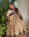 This long-sleeve cream cotton maxi dress blends elegance with comfort. Handmade, breathable & maternity-friendly. Order today!