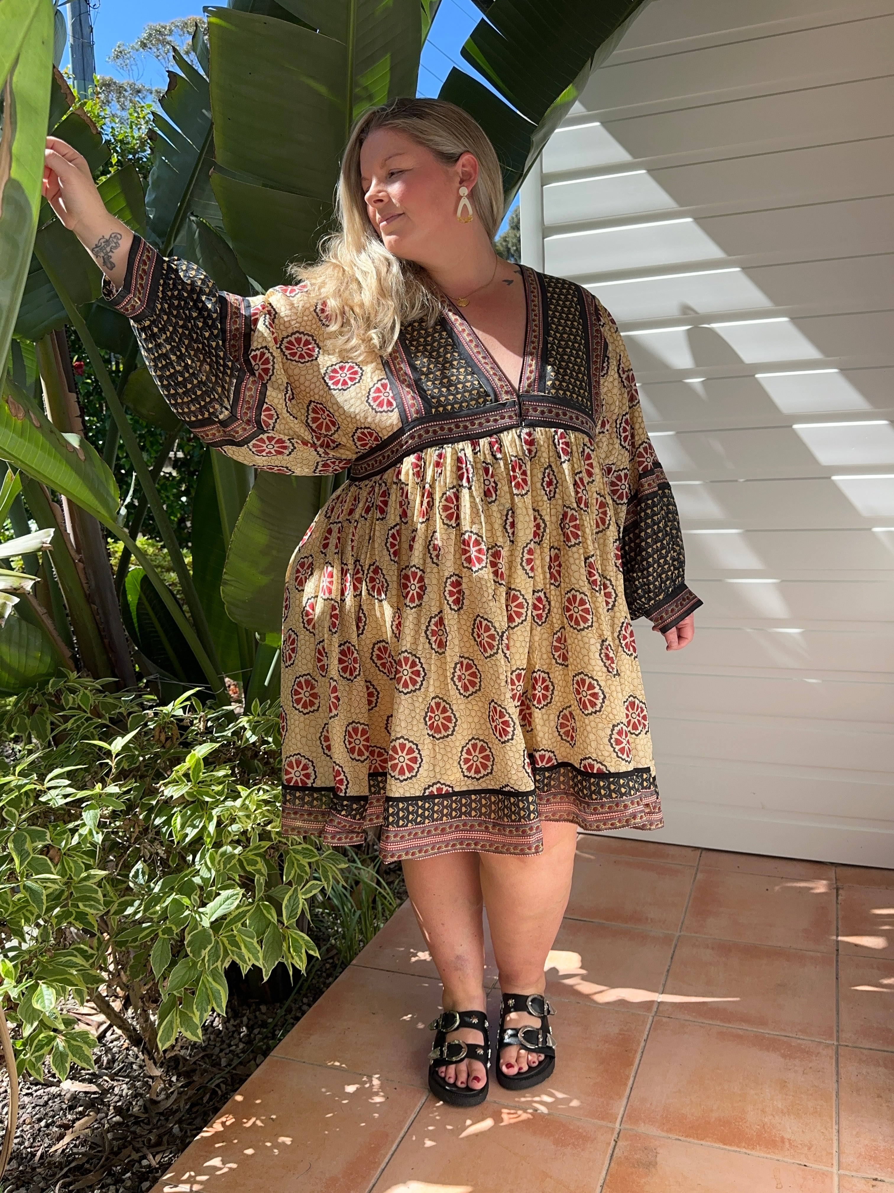 This cream cotton midi with long sleeves is breathable, flattering & made for effortless elegance. Shop sustainable fashion now!