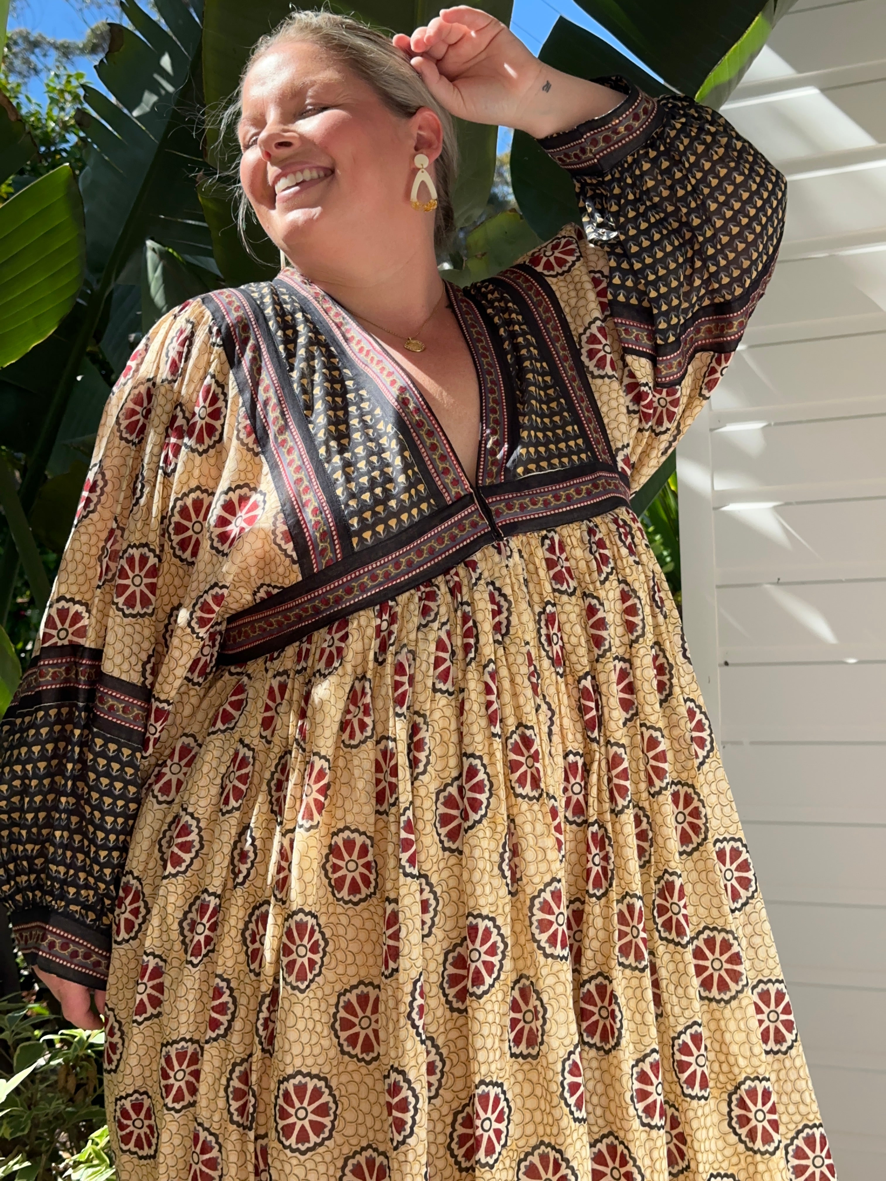 This cream cotton midi dress with long sleeves is perfect for any occasion. Ethical, timeless & comfy—shop now!