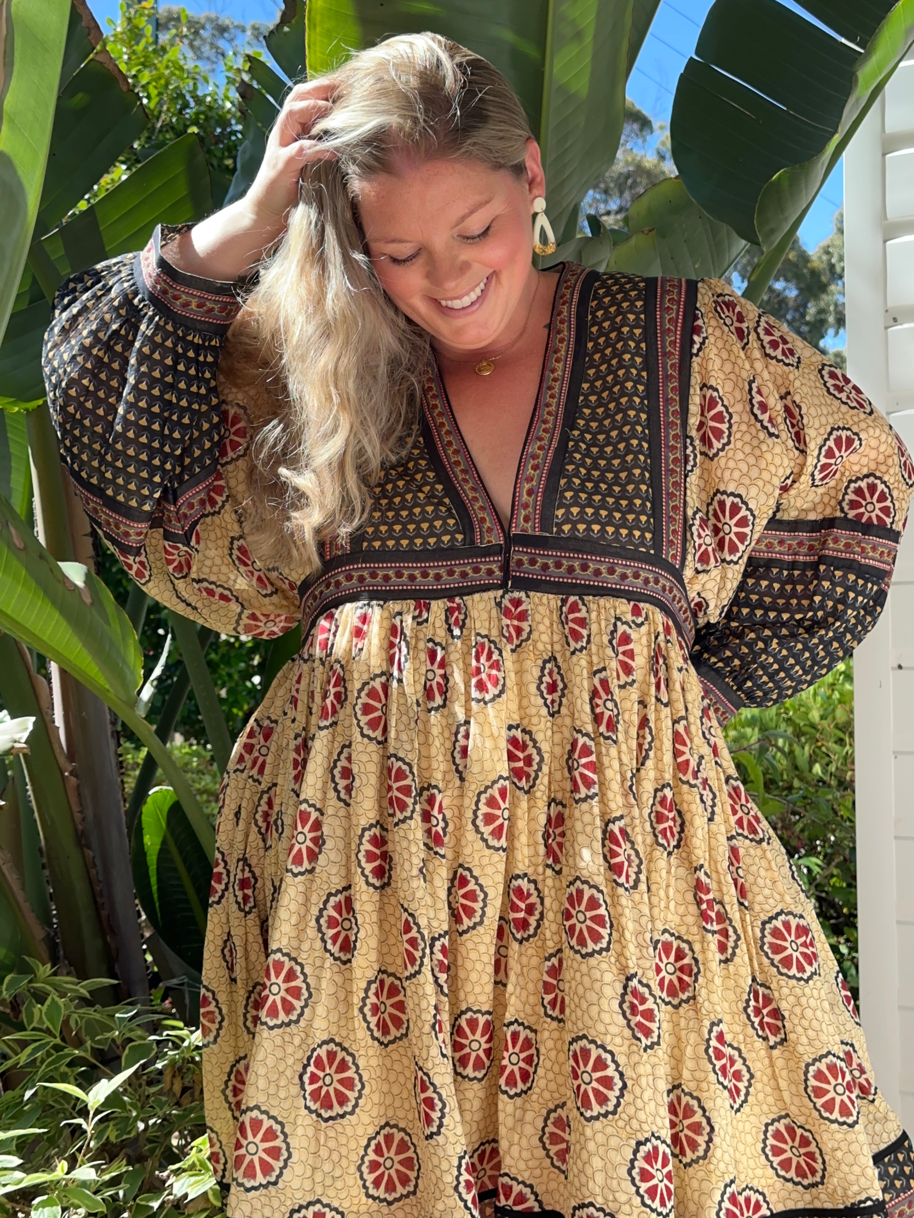 Our cream cotton midi dress with long sleeves is soft, breathable & eco-friendly. Feel good, look stunning!