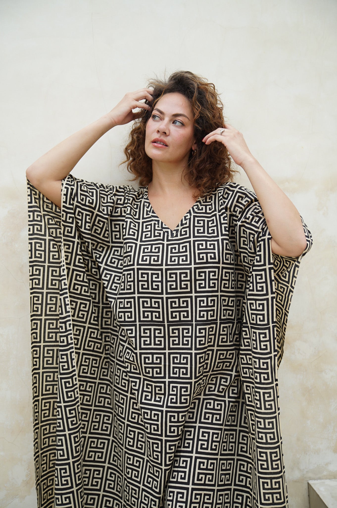 Make a statement in our long kaftan with unique geo-print design. Perfect for lounging or a day out. Shop now for chic and comfort combined!