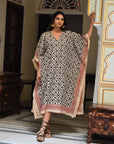 "Eco-conscious cotton kaftan: Long silhouette ensures eco-friendly elegance and comfort."