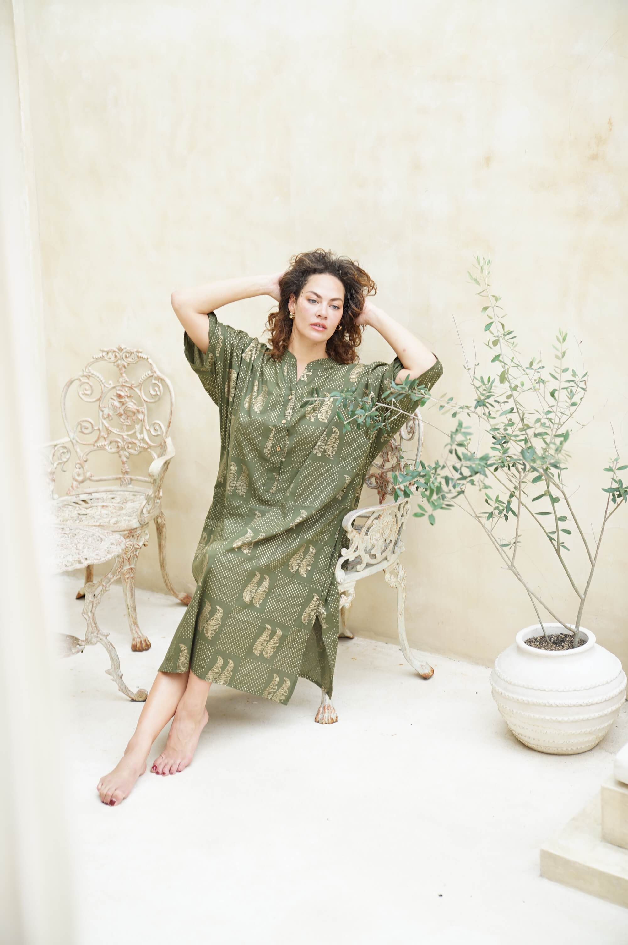 "Discover the allure of our green long shirt dress. Sophisticated, trendy, and always on point. Shop now!"