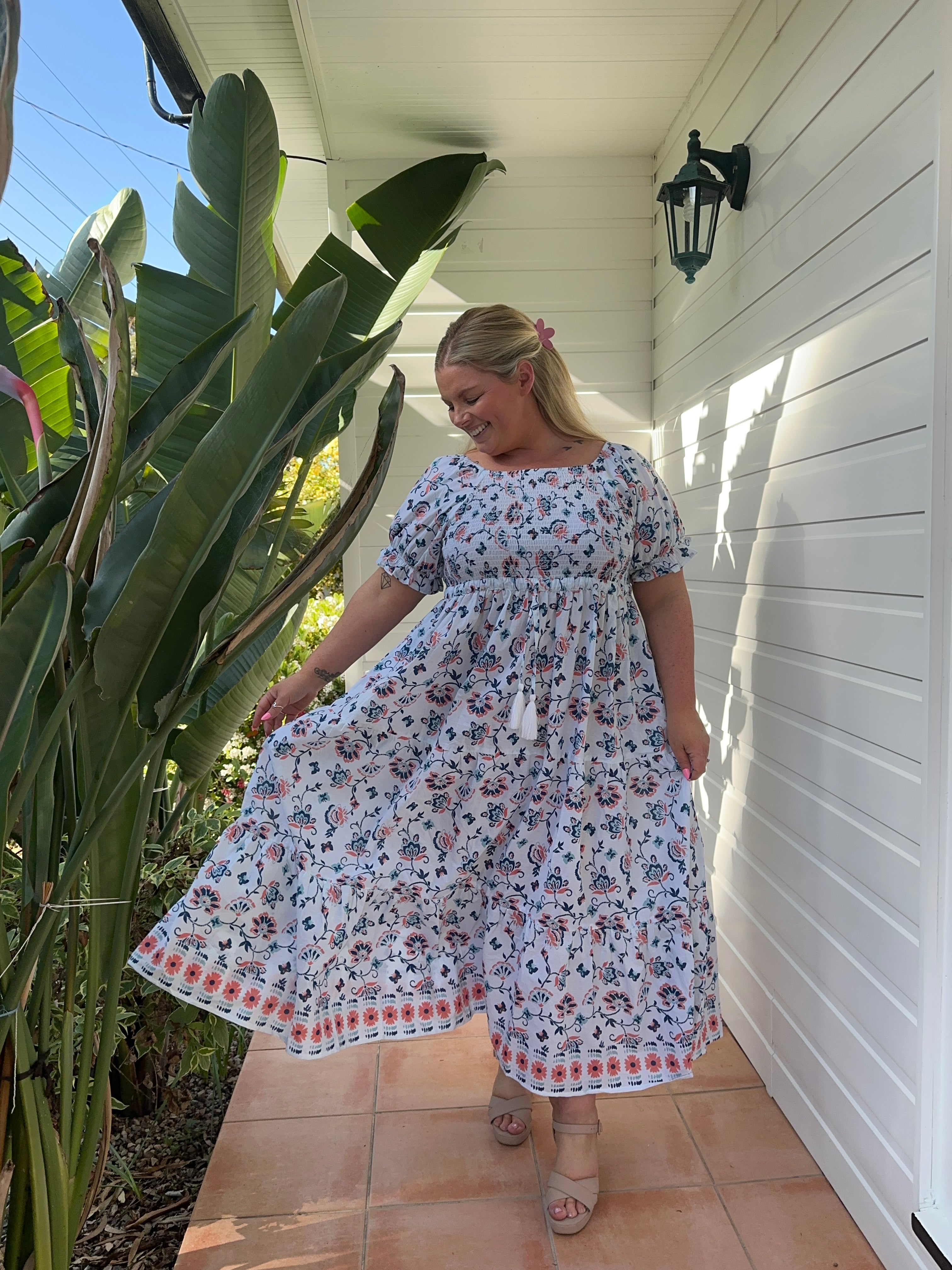 Stylish blue maxi dress with a shirred top and a breezy, ankle-length design, perfect for casual or dressy occasions.