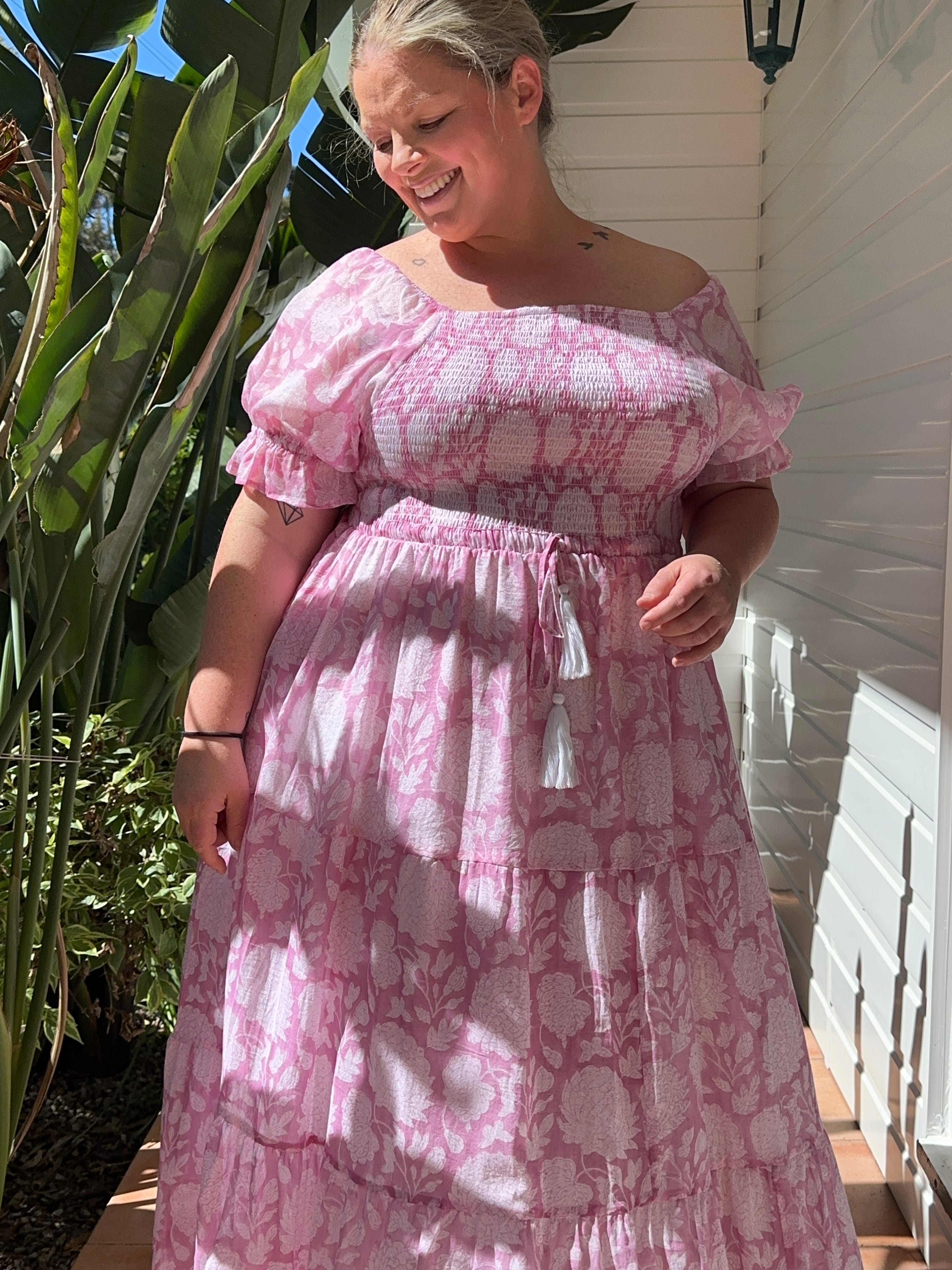 Shop the pink floral shirred-top cotton maxi dress for a flattering, breezy look. Perfect for day-to-night wear!