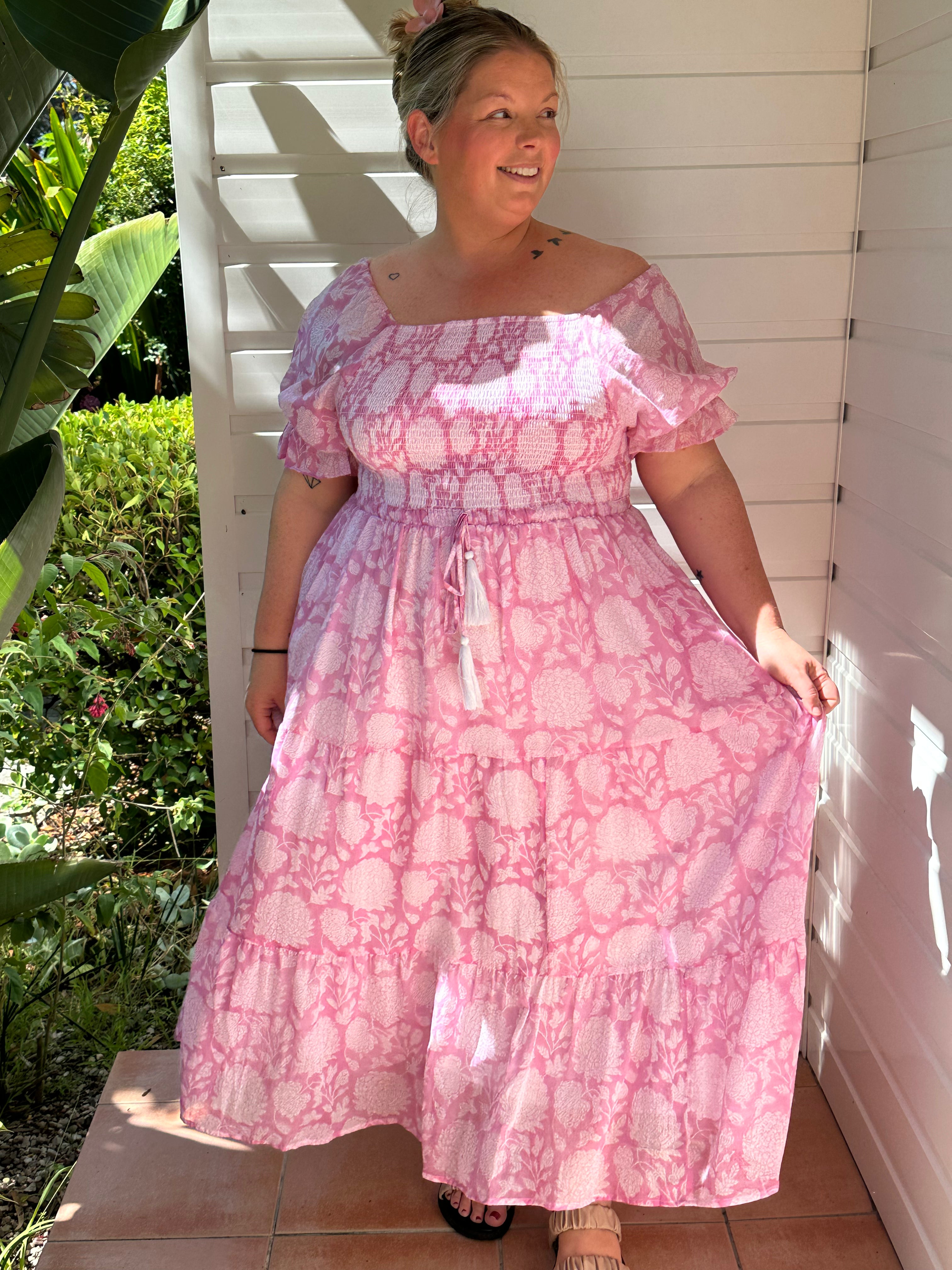 Find your perfect summer dress! The pink floral shirred-top cotton maxi is designed for elegance and comfort.