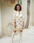 "Cotton midi dress featuring floral pattern: Long sleeves enhance the elegance of this attire."