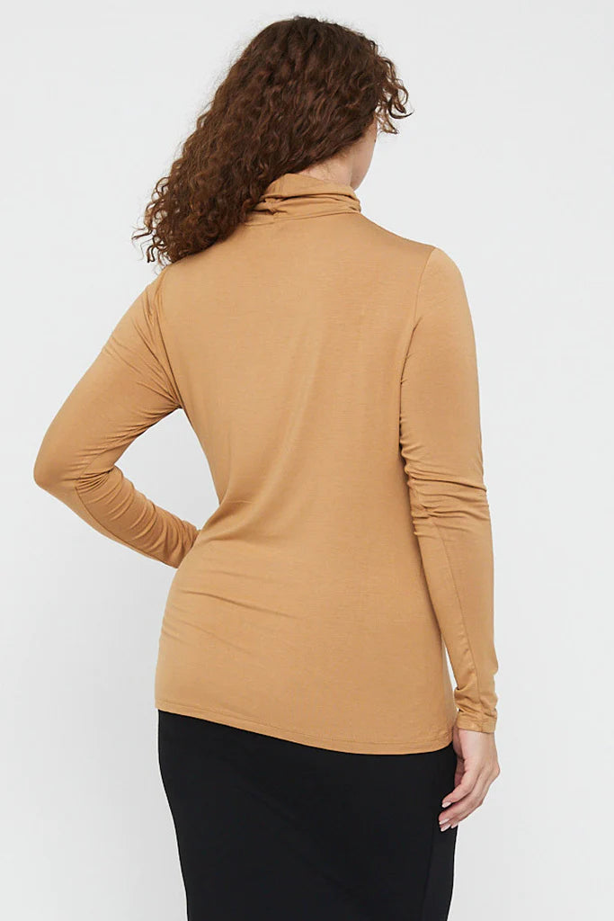 "Bamboo women's turtle neck top: Stay chic and comfortable in beige, crafted from buttery soft fabric."