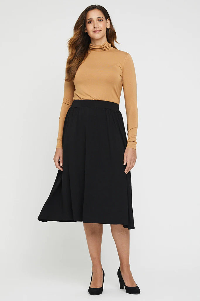 "Beige bamboo women's turtle neck top: Experience buttery softness and eco-friendly style in this versatile garment."