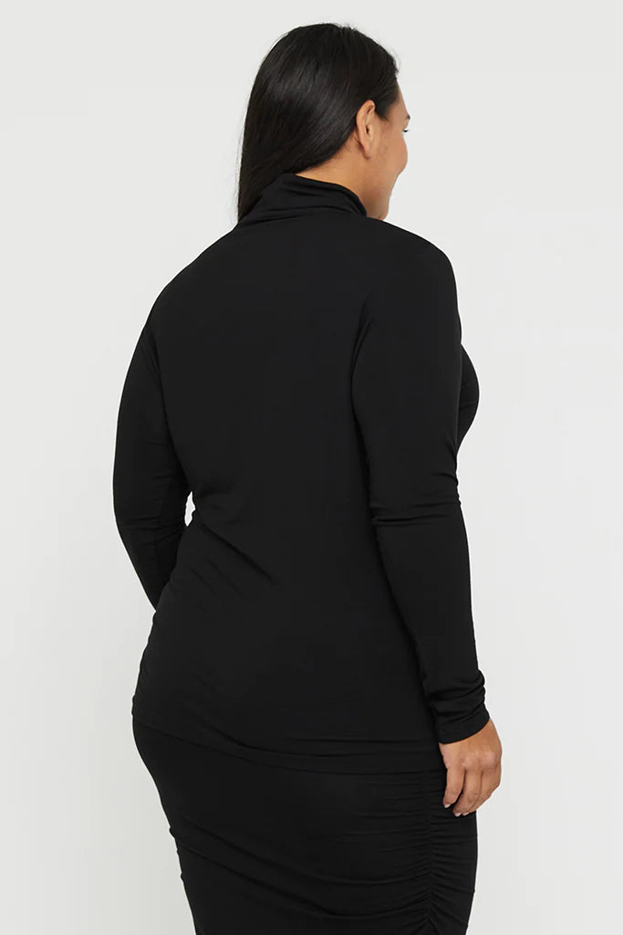 "Black turtle neck bamboo women's top: Luxuriously soft and eco-friendly, perfect for chic comfort."