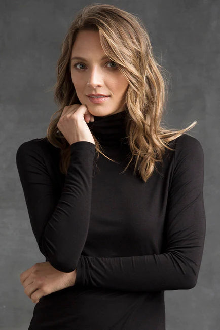 "Eco-friendly bamboo women's clothing: Black turtle neck top offers buttery softness and sophistication."