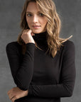 "Eco-friendly bamboo women's clothing: Black turtle neck top offers buttery softness and sophistication."