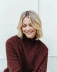"Indulge in luxury with our rust merino sweater. Crafted for elegance and warmth. Shop the look!"