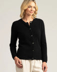 "Wrap yourself in luxury with our black merino wool button-up cardigan. Effortless chic for any occasion."