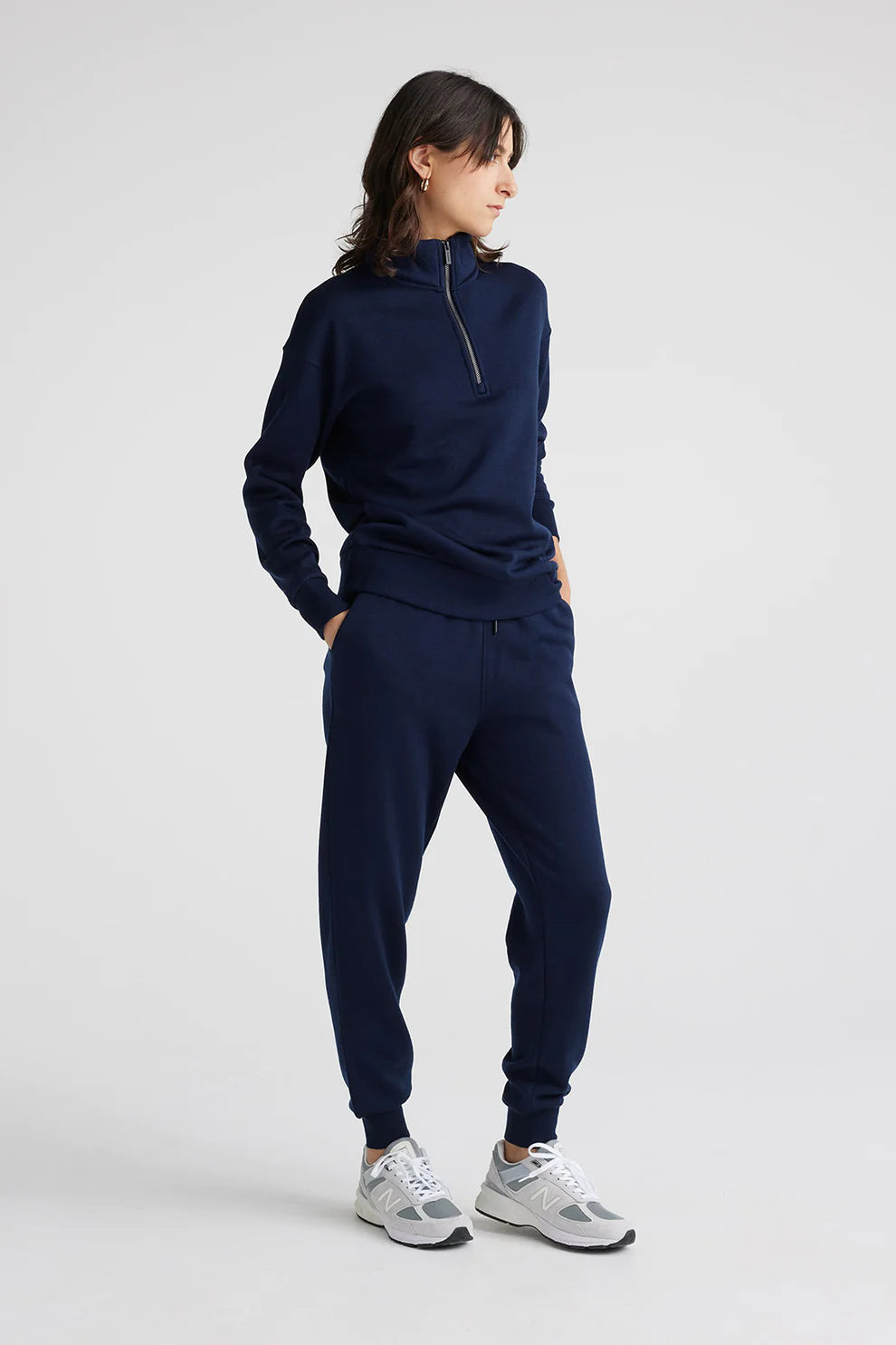 Indulge in luxury with our navy Merino wool zip collar sweater. Effortlessly chic, endlessly comfortable.