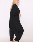 Elevate your style with our chic plus-size long sleeve black top. Flattering fit, timeless appeal. Shop now!