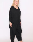 Discover confidence in our plus-size long sleeve black top. Perfect for any occasion. Get yours today!