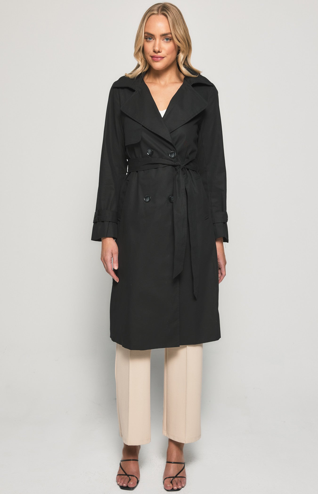 Step out in style with our black trench coat. Classic, versatile, and perfect for every outfit. Don't miss out on this wardrobe essential.