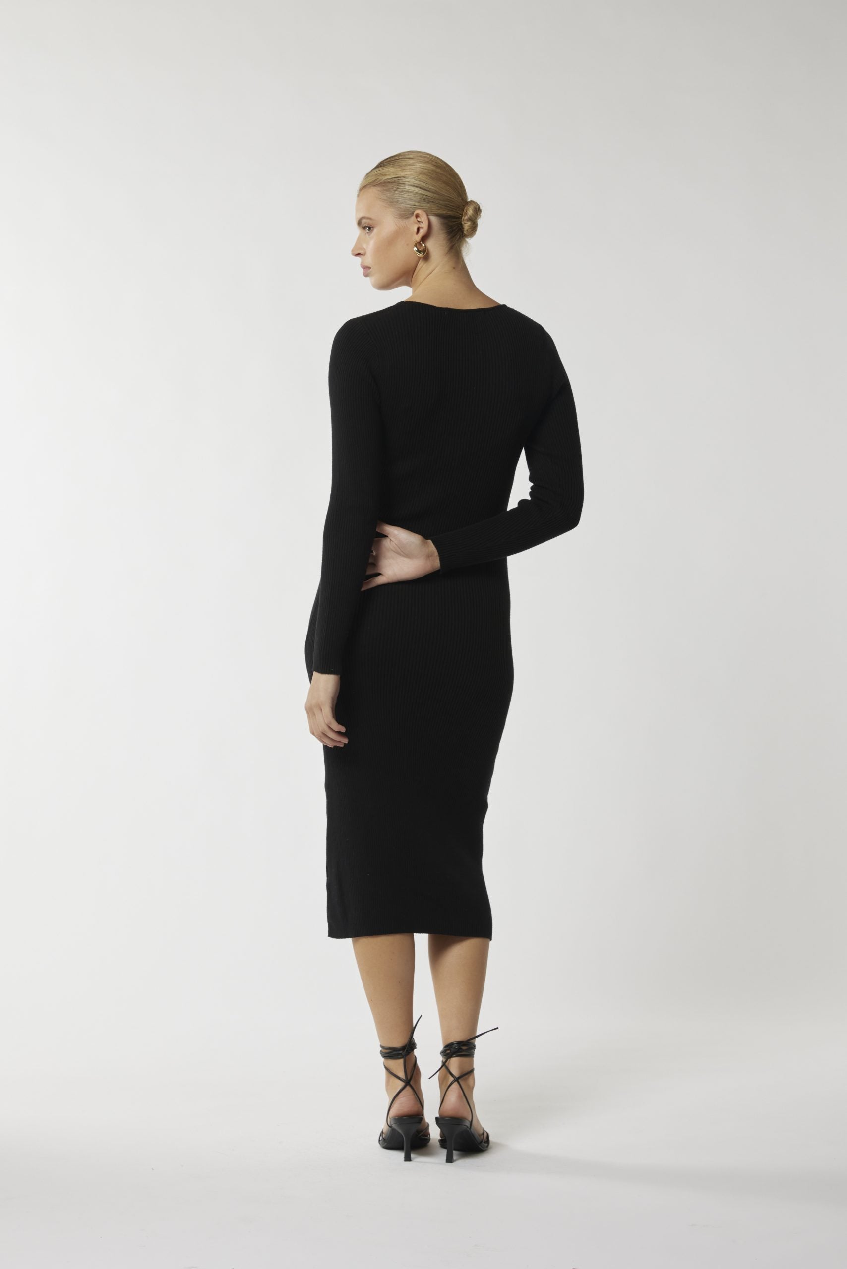 "Make a statement with our chic cut-out waist black midi dress. Get yours for a stunning look!"