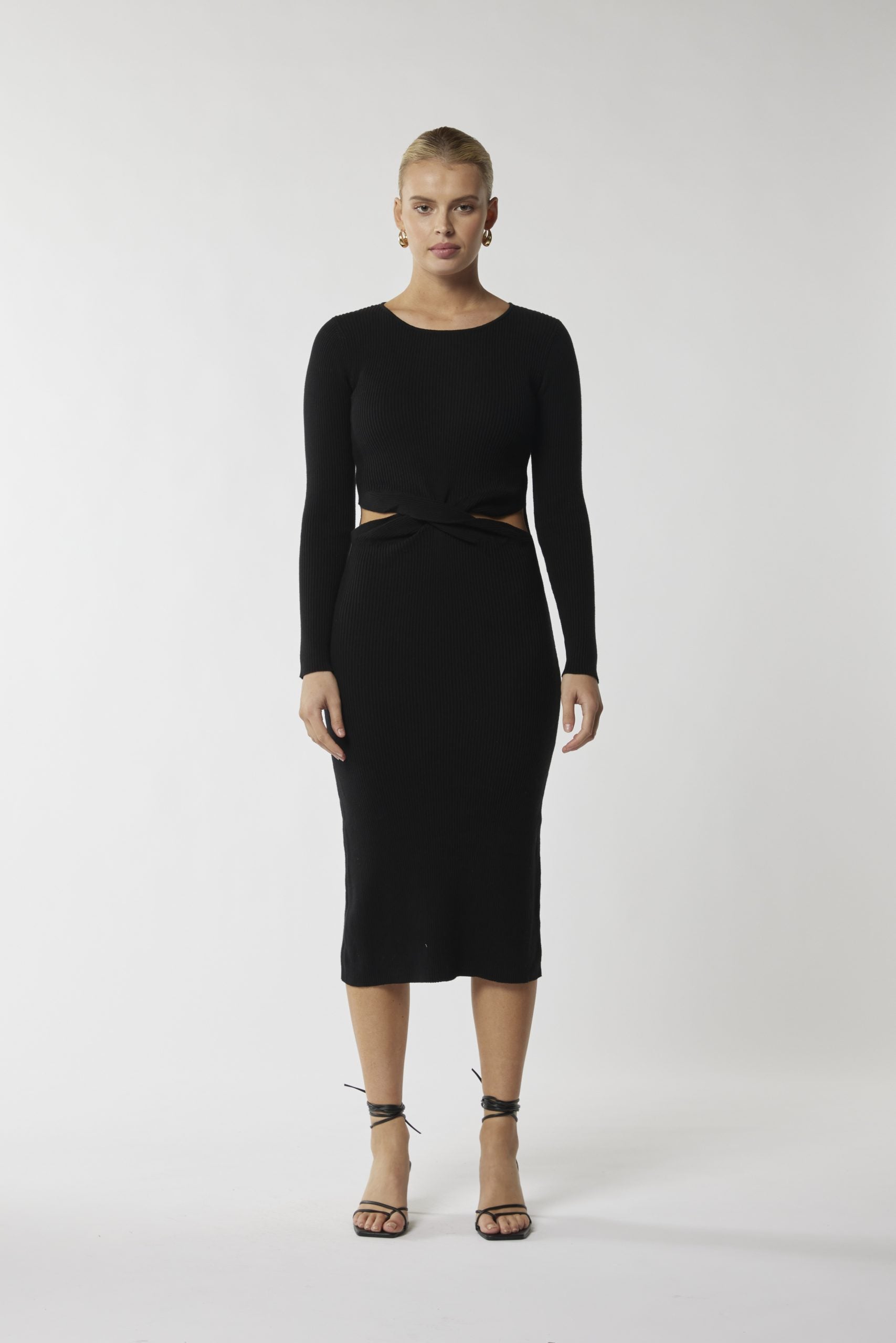 "Turn heads with our sleek black midi dress, designed to enhance your silhouette effortlessly. Shop now!"