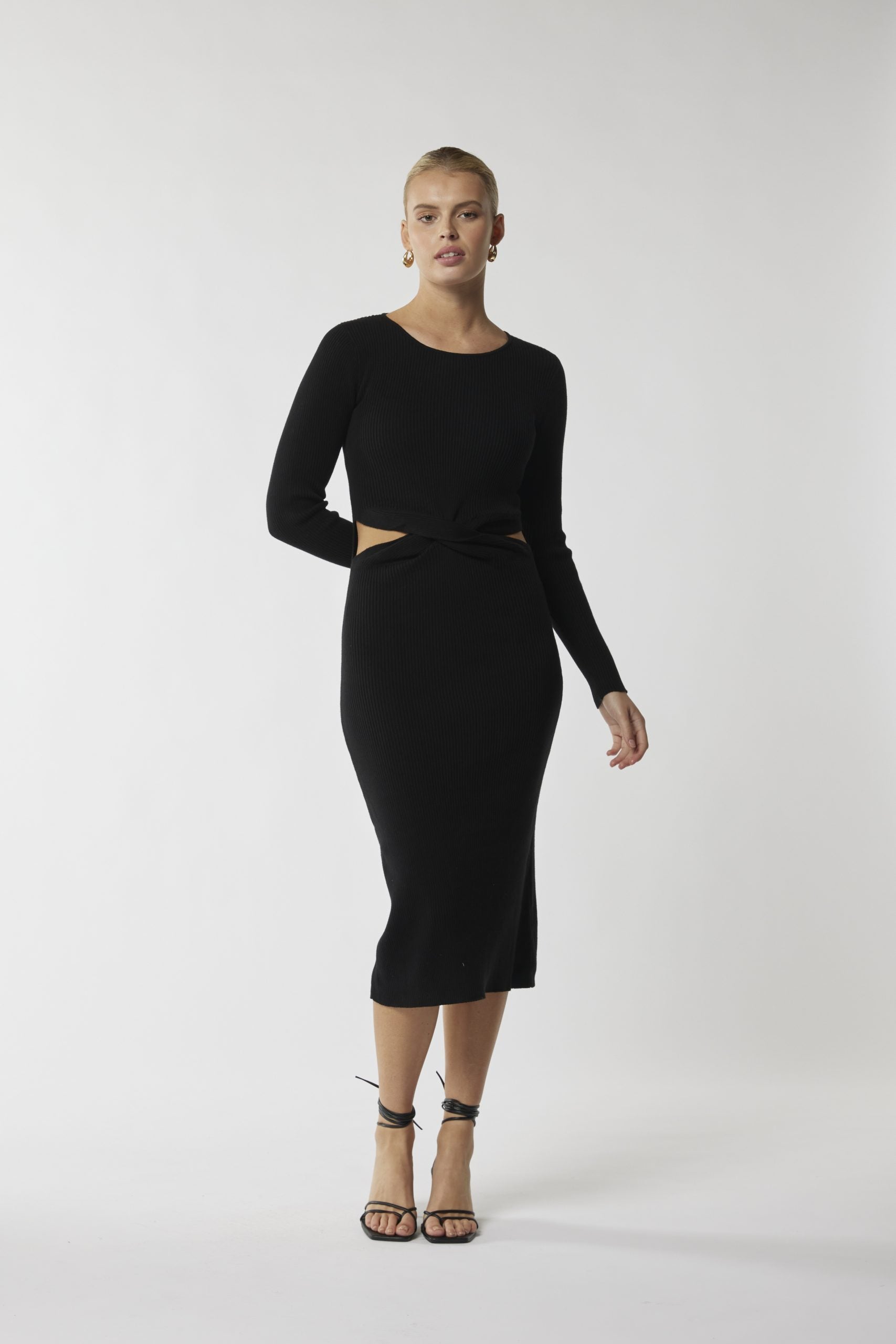 "Unlock confidence in our must-have black midi dress. Effortlessly chic, endlessly versatile!"
