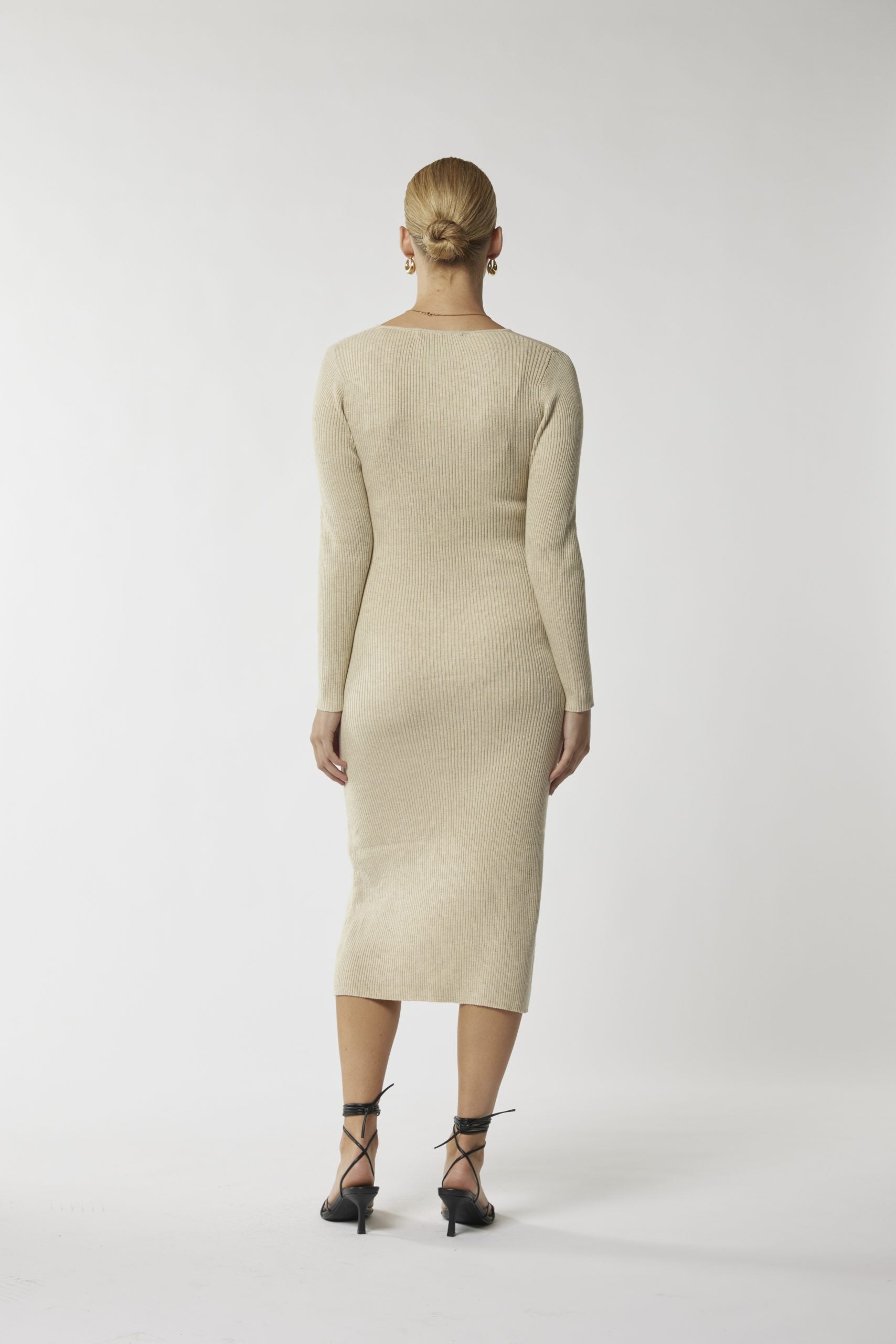 Sculpted style: Beige cut-out midi dress for a flawless silhouette. Shop now!