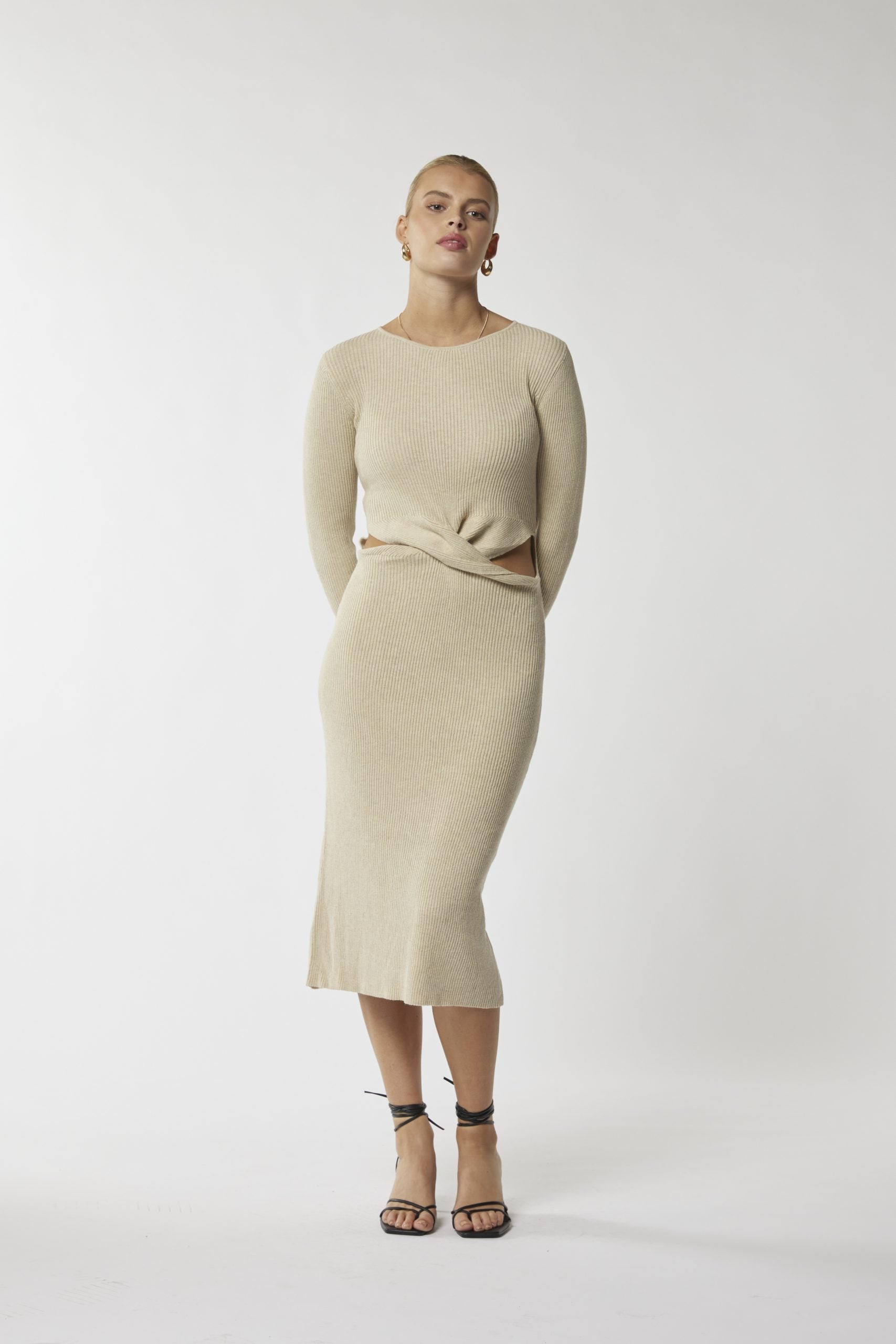 Turn heads effortlessly: Beige midi dress with sleek waist cut-out. Shop now!