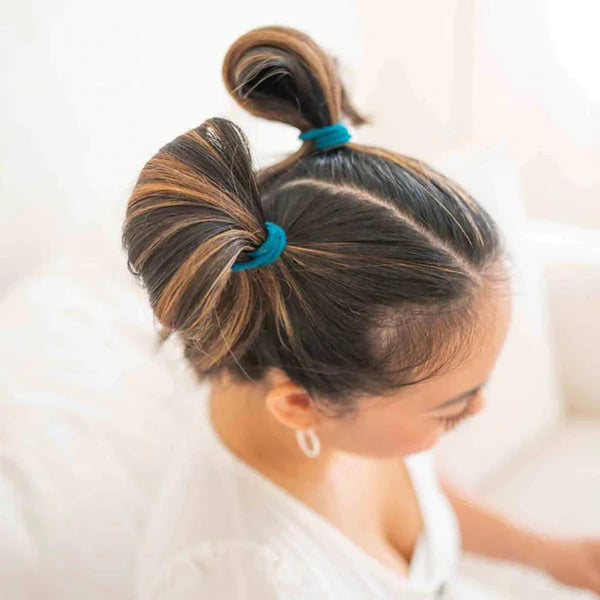 "Kooshoo's eco-friendly hair ties in purple, black, and blue offer a strong, stylish hold without plastic waste. Shop sustainable hair accessories today!"