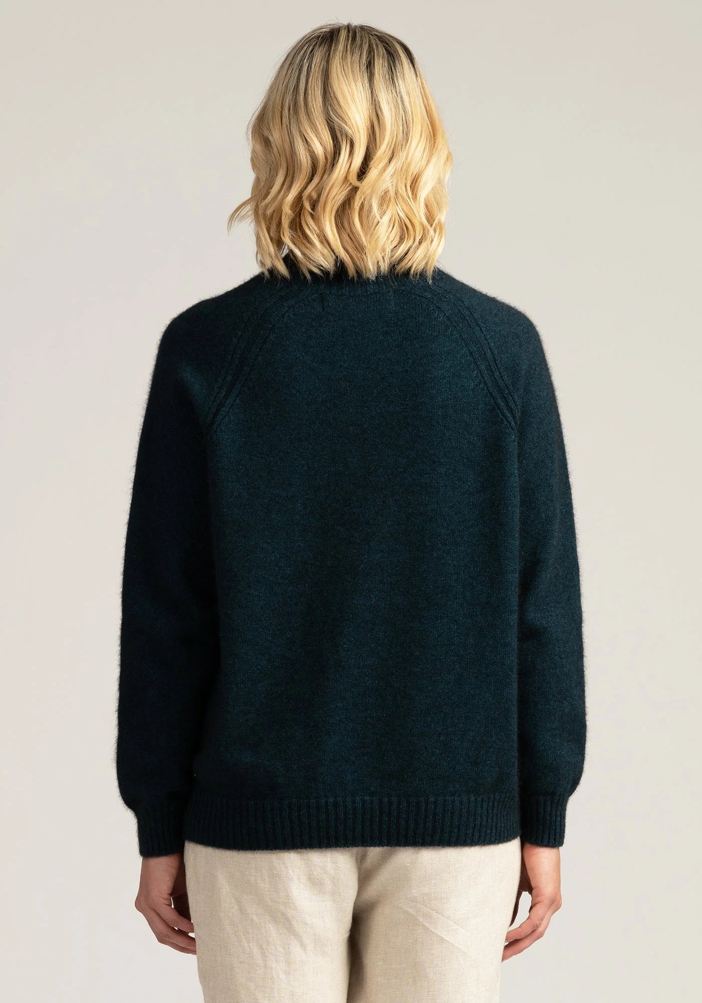 Wrap yourself in luxury: Peacock green merino wool jumper, warmth meets style!