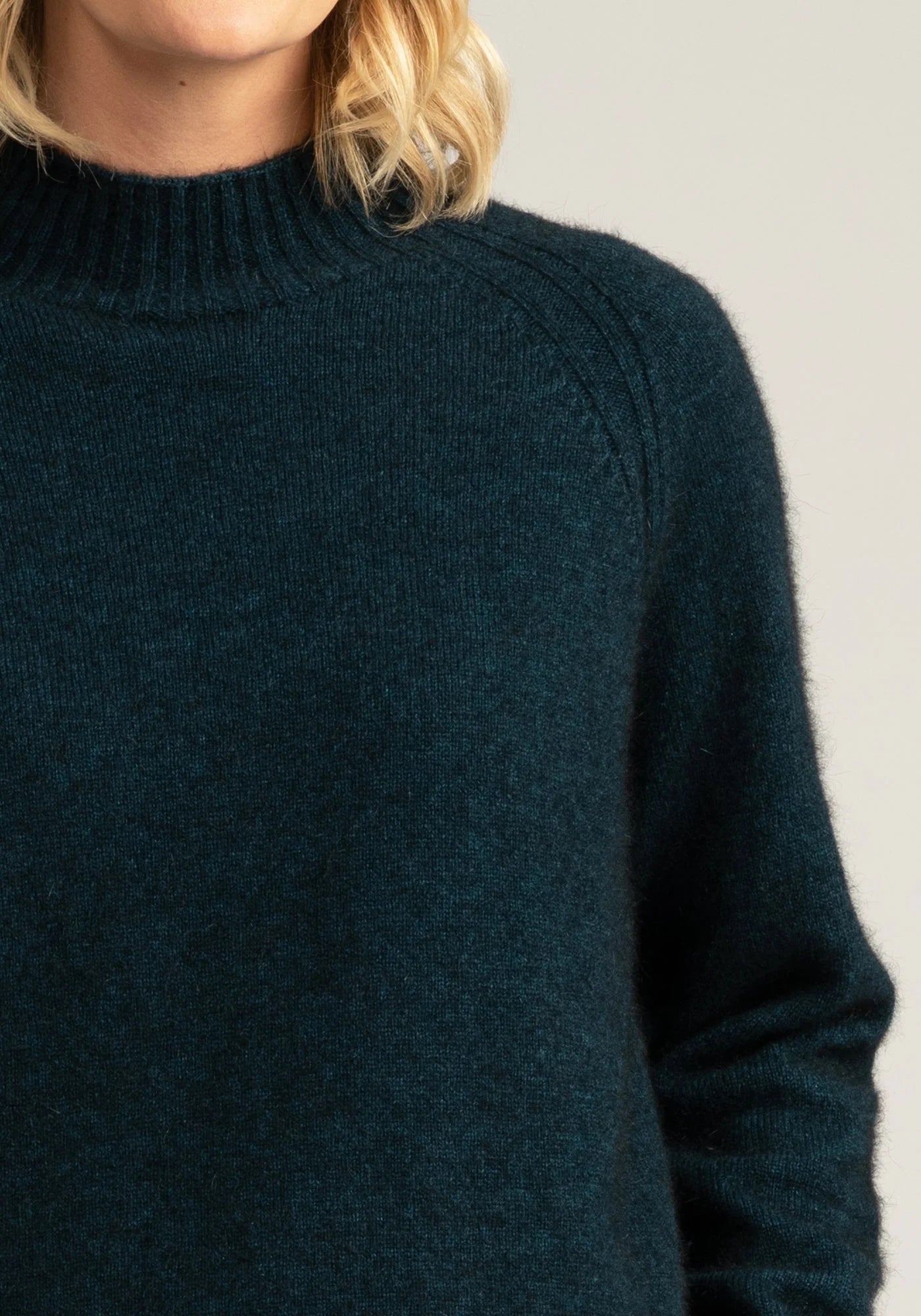 Elevate your wardrobe with our merino wool jumper in stunning peacock green.