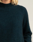 Elevate your wardrobe with our merino wool jumper in stunning peacock green.