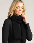 Wrap yourself in comfort and style with our black merino wool ribbed scarf. The ultimate cold-weather accessory!