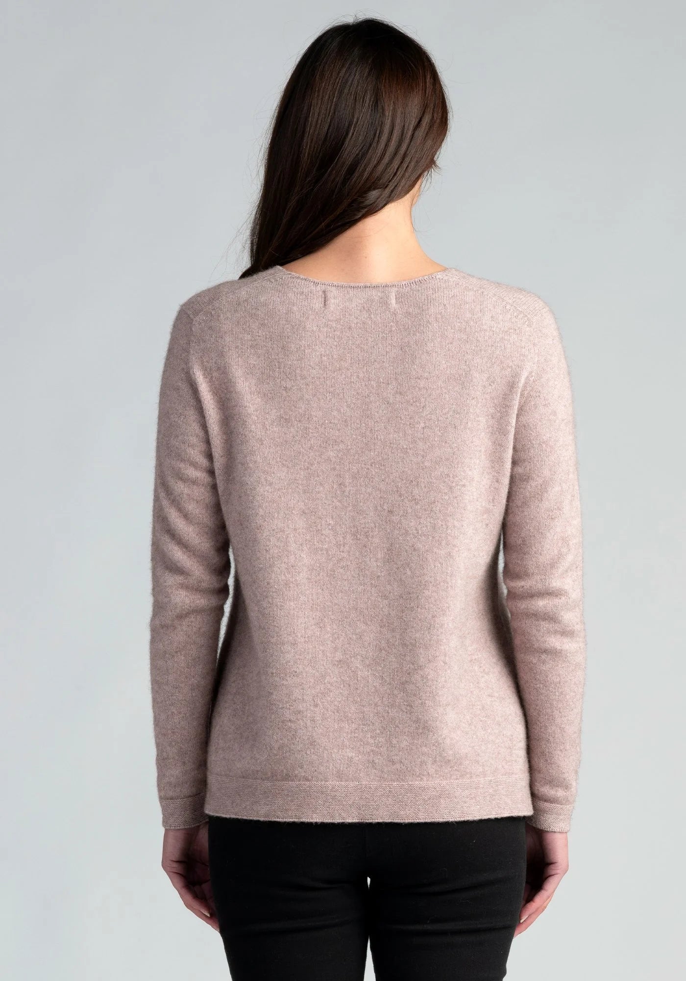 "Stay cozy in style with our blush pink merino wool sweater. Soft, chic, and irresistible. Shop now!"