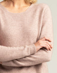 "Discover the allure of blush pink in our merino wool sweater. Comfort meets couture in every stitch."