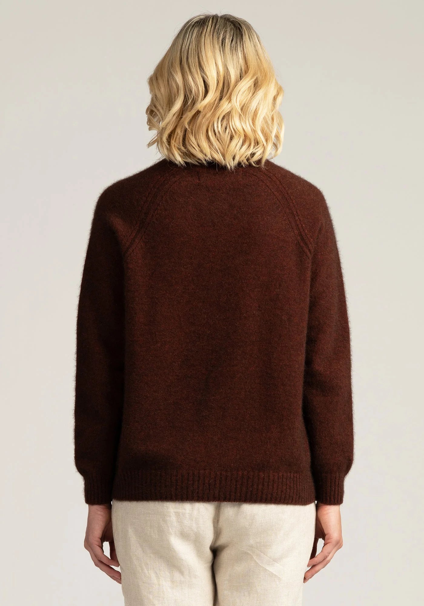 "Experience warmth in style with our rust merino wool sweater. Luxuriously soft and timeless. Shop now!"