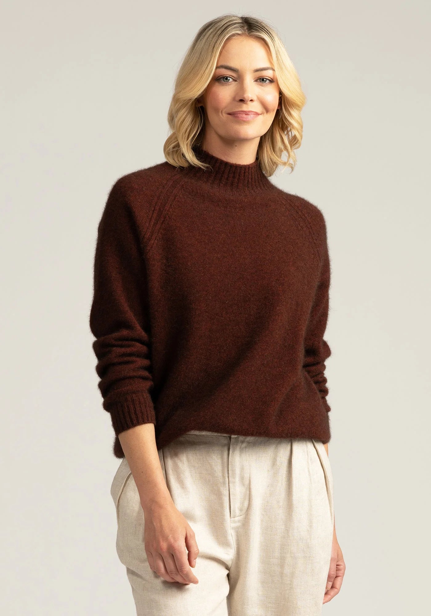 "Stay cozy and chic in our rust merino sweater. Premium wool for enduring style. Get yours now!"