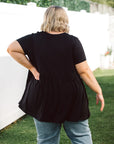 Effortlessly chic and versatile, our Plus-Size Wide Black Top is a wardrobe must-have. Featuring pockets for added convenience and style.