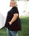 Upgrade your look with our stylish Plus-Size Wide Black Top! Complete with pockets for convenience, it's the perfect blend of fashion and function.