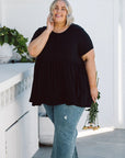 Stay on-trend and comfortable in our Plus-Size Wide Black Top! Designed with pockets and a flattering fit, it's the ultimate wardrobe essential.