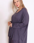 Discover the perfect blend of style and comfort in our grey plus-size cotton top. Embrace fashion that fits!