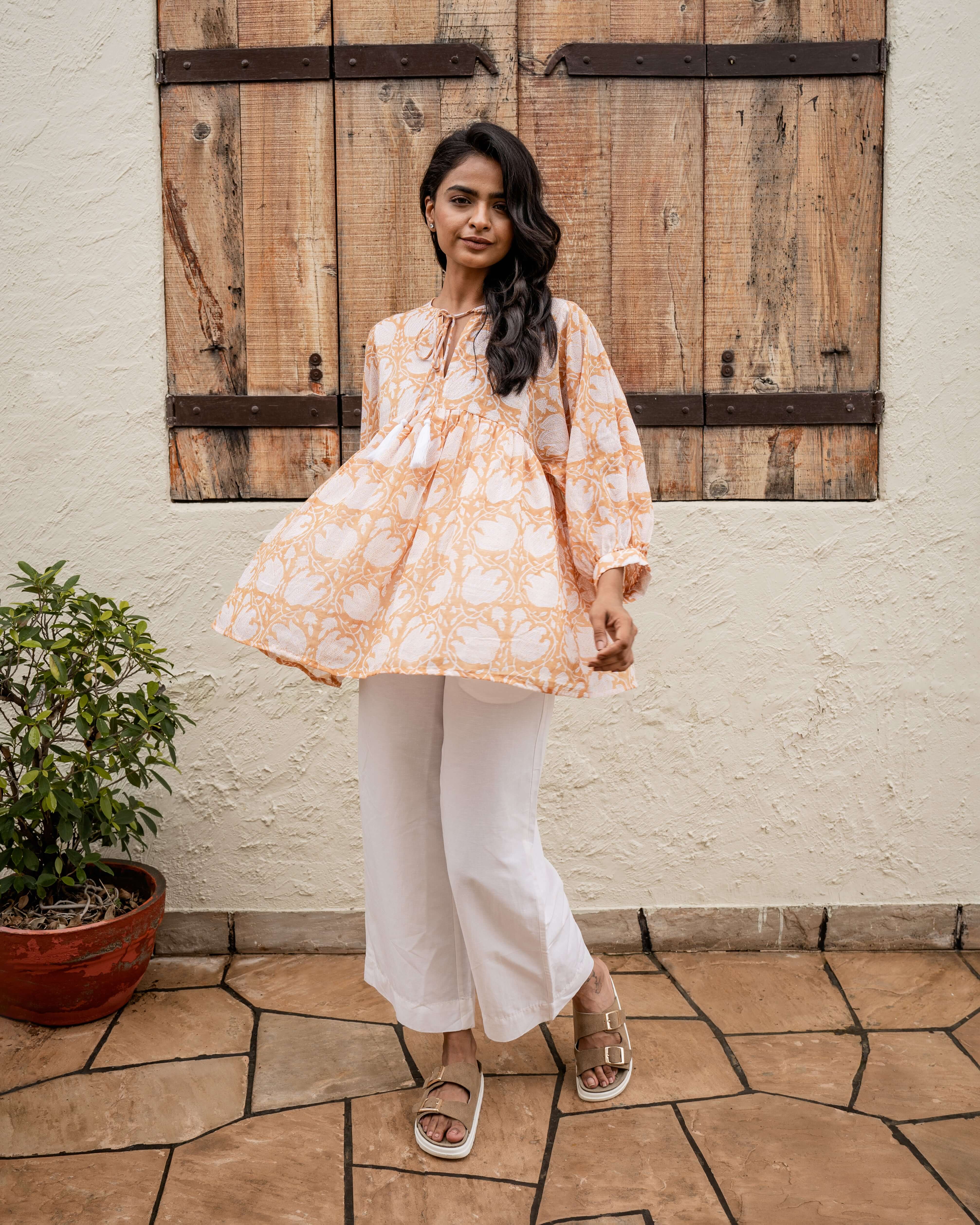 Timeless caramel floral top with vintage tropical block print, 3/4 sleeves, and relaxed fit for comfort and sophistication.